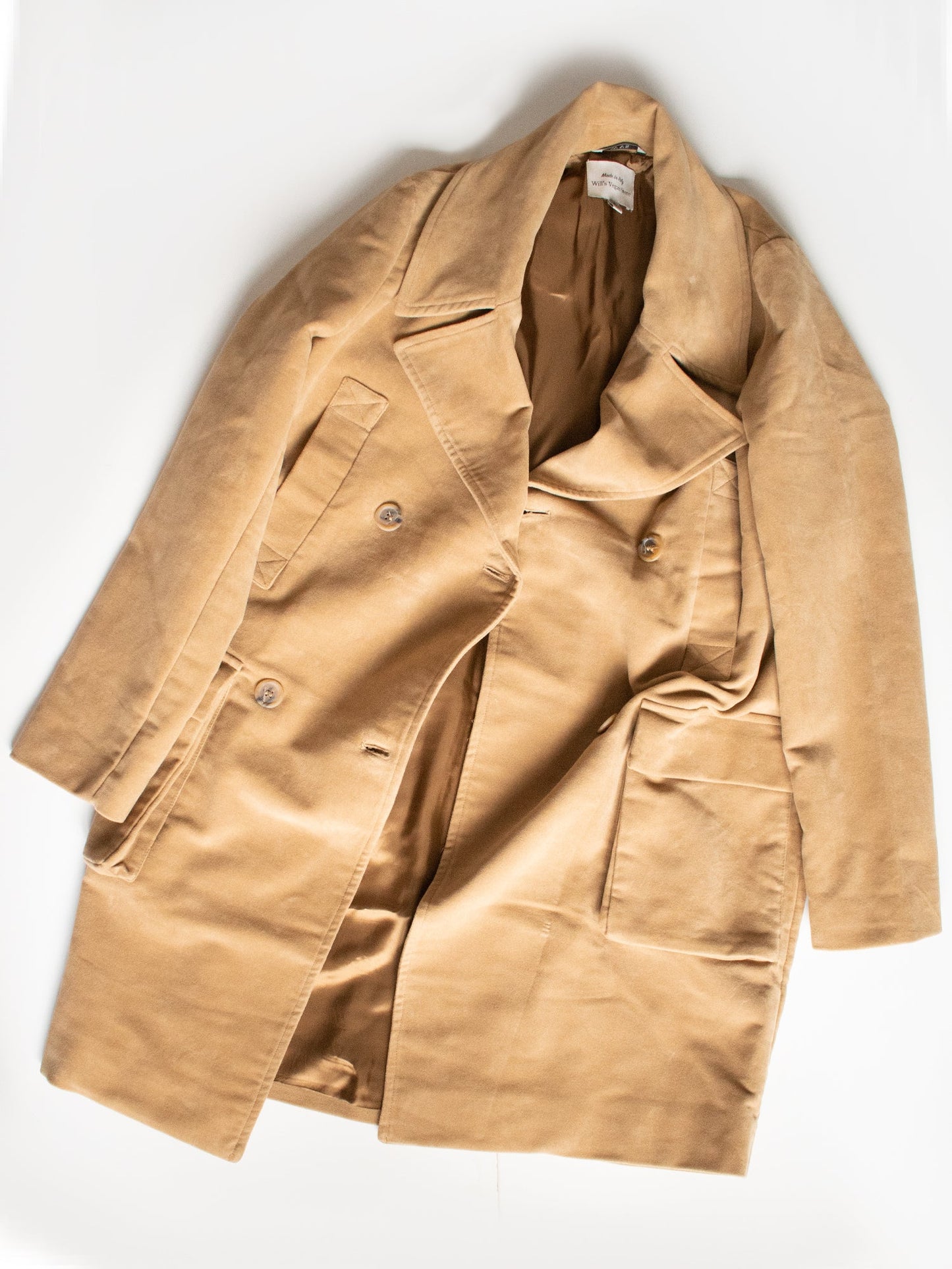 Beige trench coat on a white background
