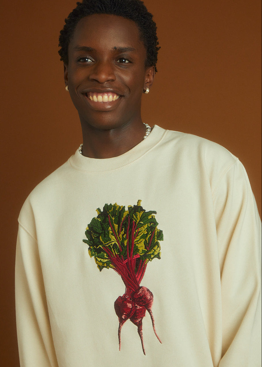 a man wearing a beetroot embroidered sweatshirt