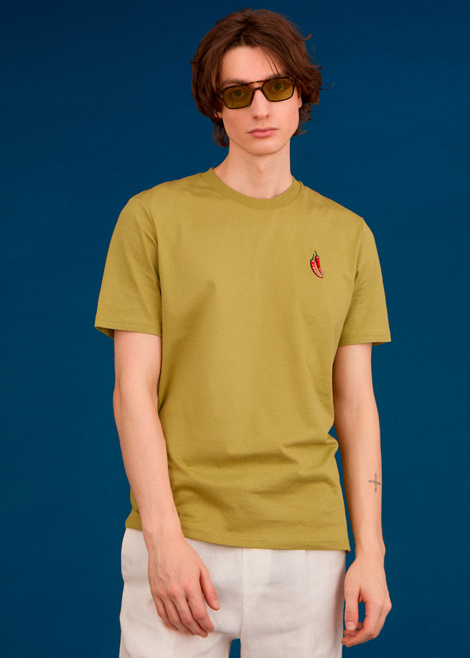 a men wearing a green top with chilli embroidery  