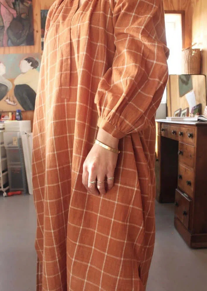 
                  
                    Grace Dress in rust check
                  
                