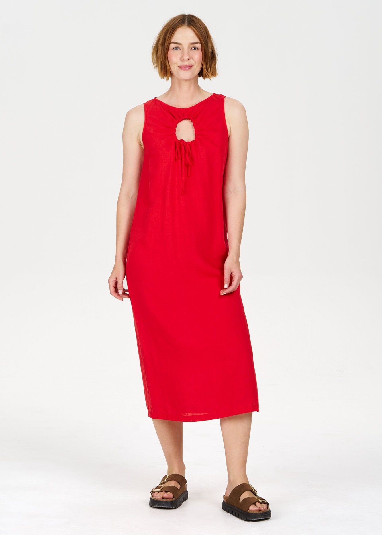 Woman wearing a red dress on a white background