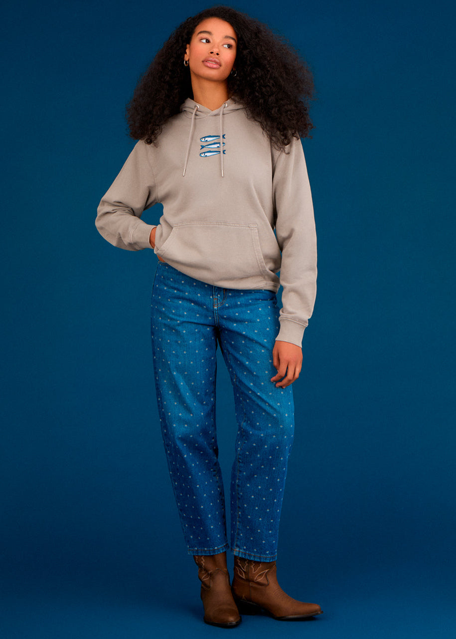 a women wearing an ingmarson hoodie with sardines embroidered  