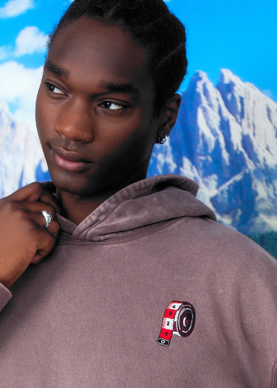 a boy in a Mocha coloured hoodie