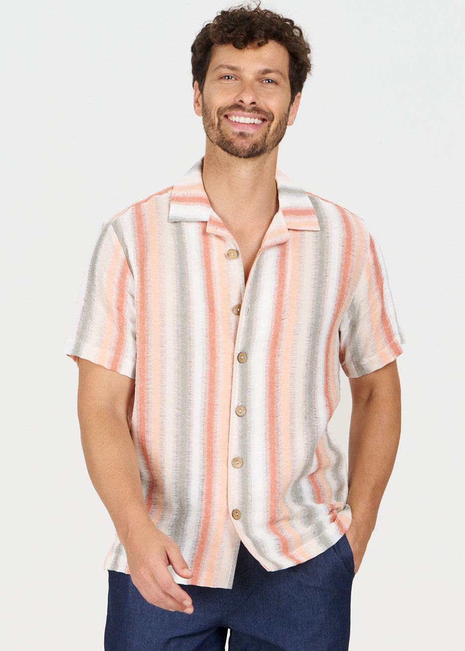 WAVE Organic Cotton Shirt displayed on a smiling man wearing a loose fit striped shirt with buttons.