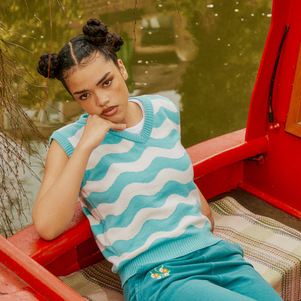 
                  
                    a person sitting on a boat
                  
                