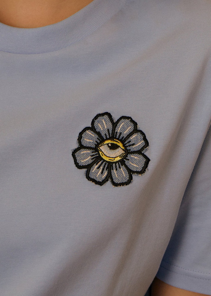 
                  
                    Women's Blue Eyed Flower Upcycled Appliqué T-Shirt - Blue
                  
                