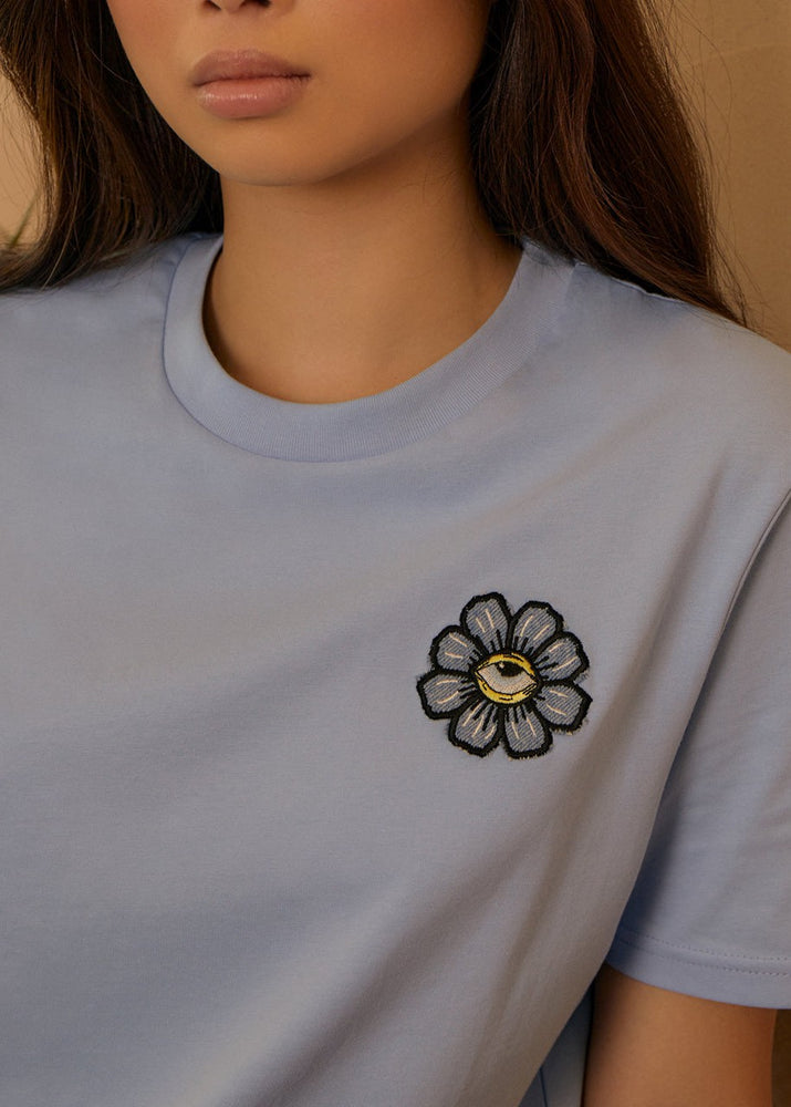 
                  
                    Women's Blue Eyed Flower Upcycled Appliqué T-Shirt - Blue
                  
                