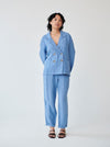 Fanfare's classic double-breasted suit with a contemporary touch. Ethically made in London this Blue Linen Suit has roll up trousers and a high waist. Perfect as a casual daytime suit or a dressed-up evening outfit, this sustainable set made in London can be worn on a variety of occasions.